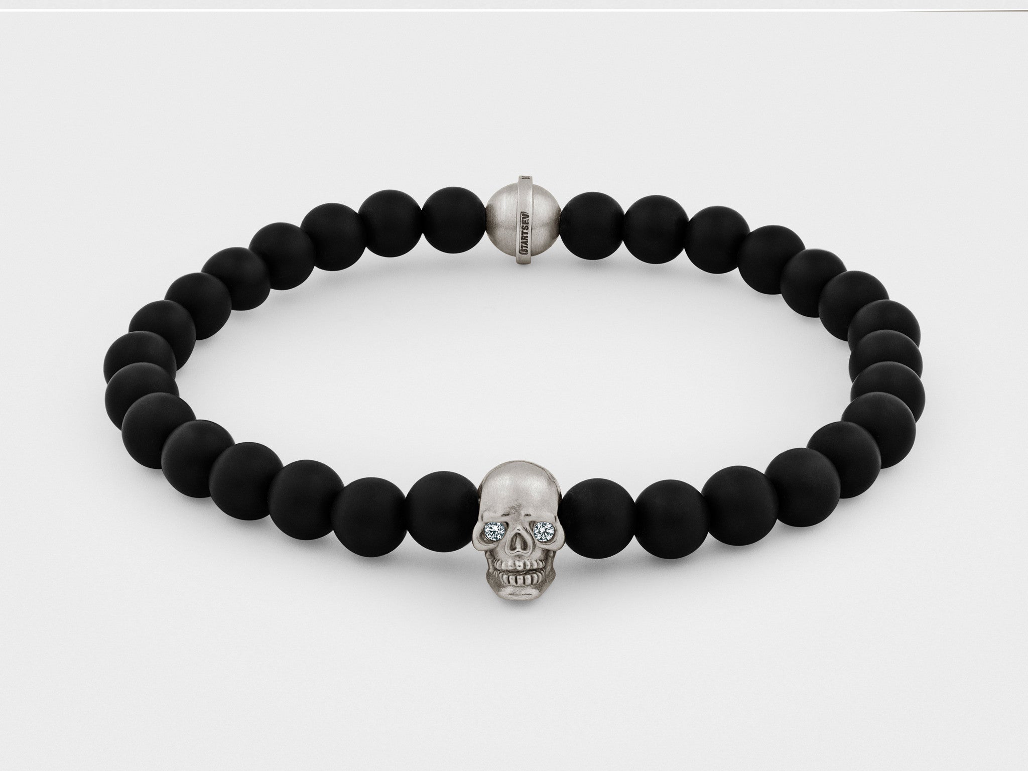 Skull Bracelet in Silver with Clear Eyes and Black Bead